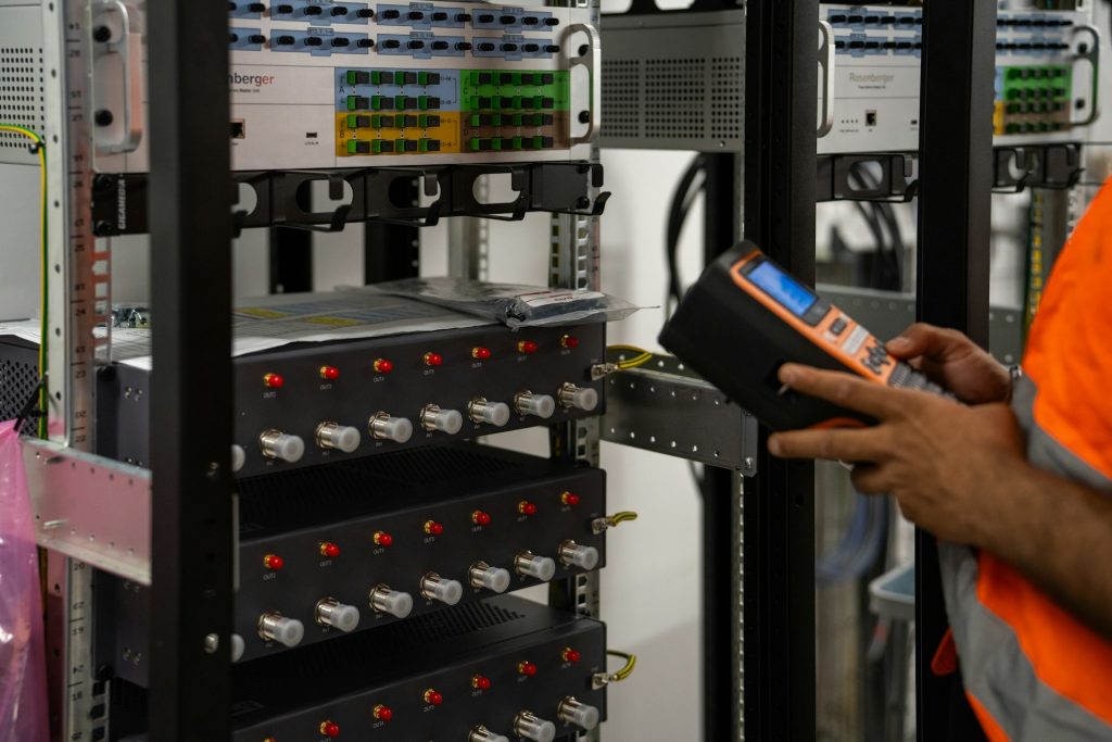 Technician inspecting server racks